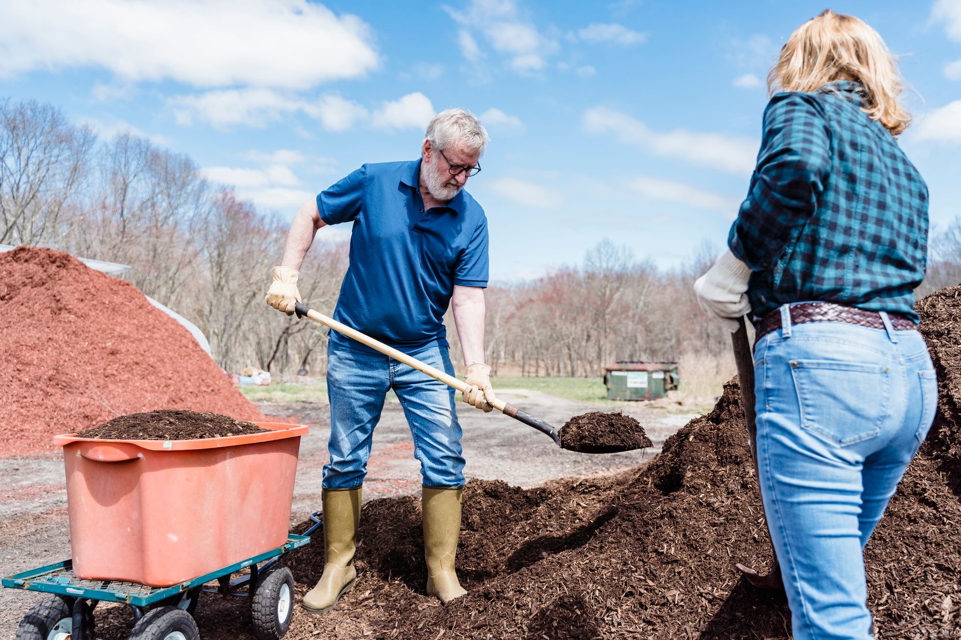 Adding compost to a raised bed