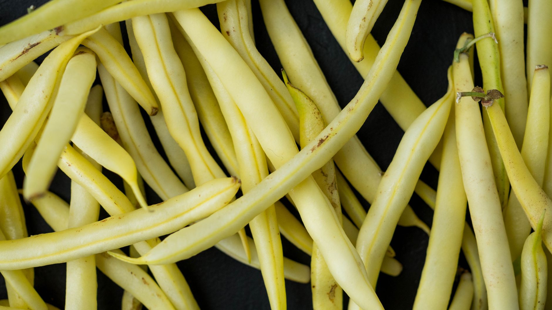 Packing green beans into jars